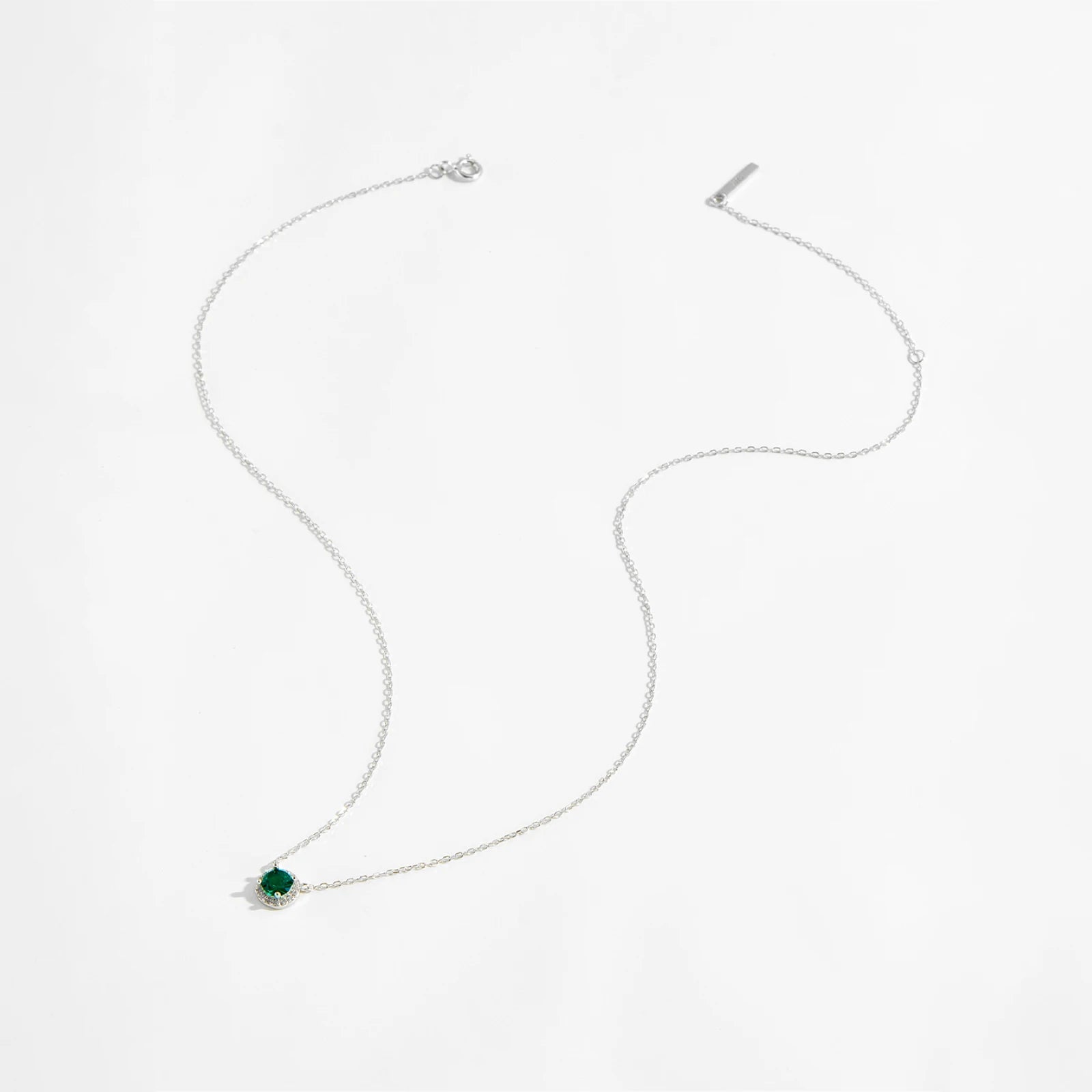 Green Gemstone Necklace, a stunning blend of elegance and sophistication. Crafted from 925 sterling silver, this pure silver necklace features a mesmerizing green stone, radiating a vibrant and timeless charm. The carefully set green garnet adds a touch of luxury, making it a perfect statement piece for any occasion.

Designed with intricate detailing, this necklace includes a delicate chain pendant, offering a refined and graceful look. Whether worn alone or layered with other choker pendants.