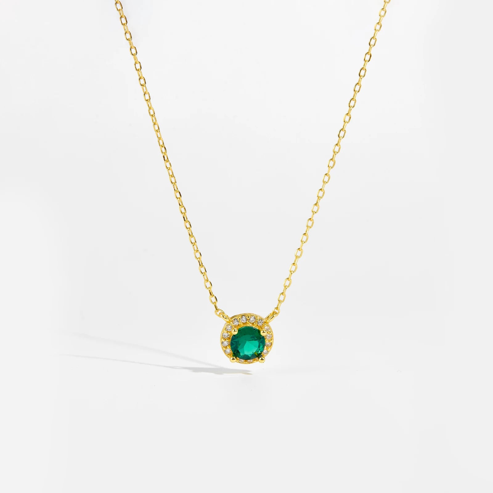 Green Gemstone Necklace, a stunning blend of elegance and sophistication. Crafted from 925 sterling silver, this pure silver necklace features a mesmerizing green stone, radiating a vibrant and timeless charm. The carefully set green garnet adds a touch of luxury, making it a perfect statement piece for any occasion.

Designed with intricate detailing, this necklace includes a delicate chain pendant, offering a refined and graceful look. Whether worn alone or layered with other choker pendants, this piece c