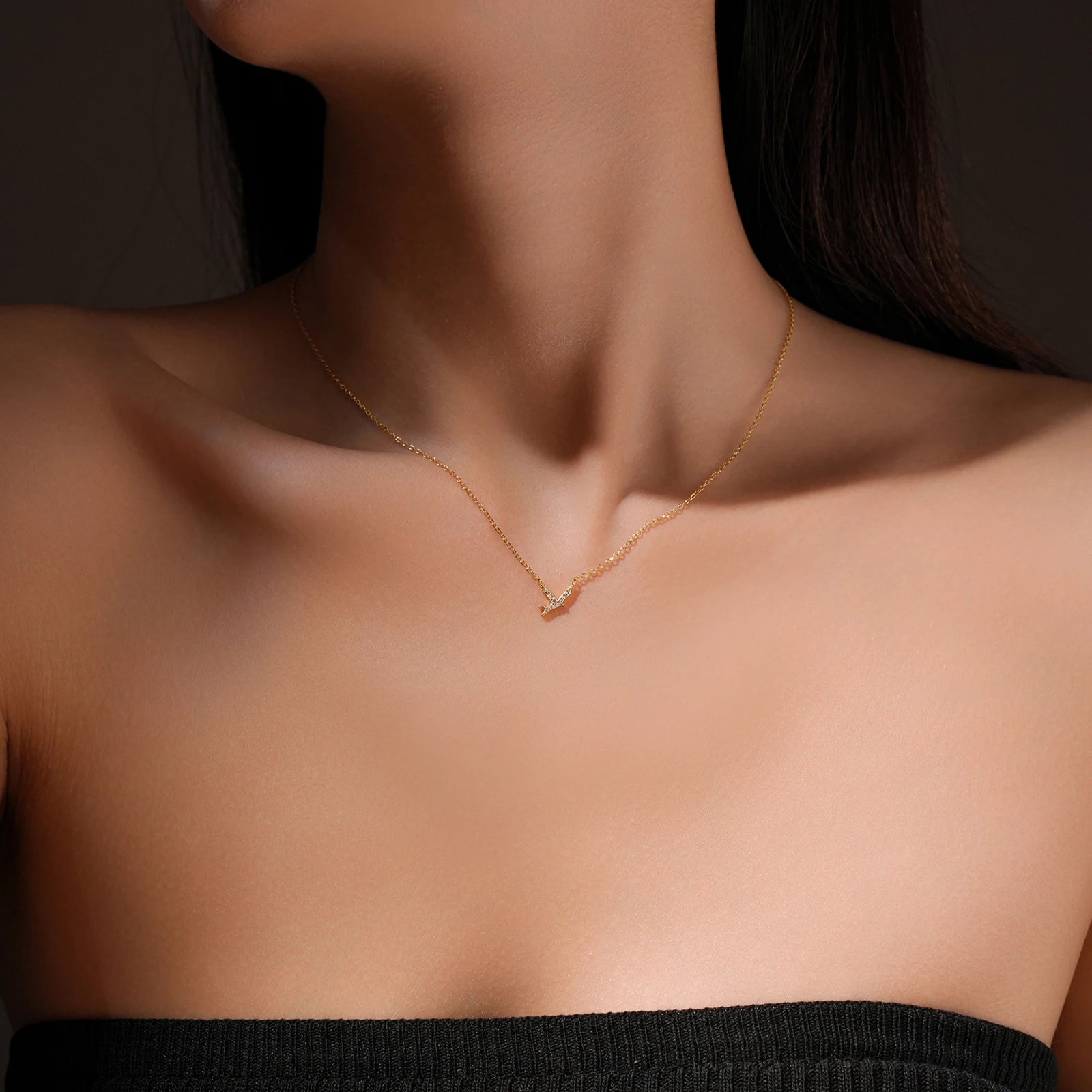 Embrace the essence of freedom and new beginnings with our Bird Pendant Necklace. Expertly crafted from 925 sterling silver, this delicate piece features a shimmering AAA cubic zirconia, capturing nature's beauty in a refined design. The pendant, measuring 9mm, gracefully hangs from an adjustable 40+5cm snake chain, ensuring a perfect fit for any neckline.