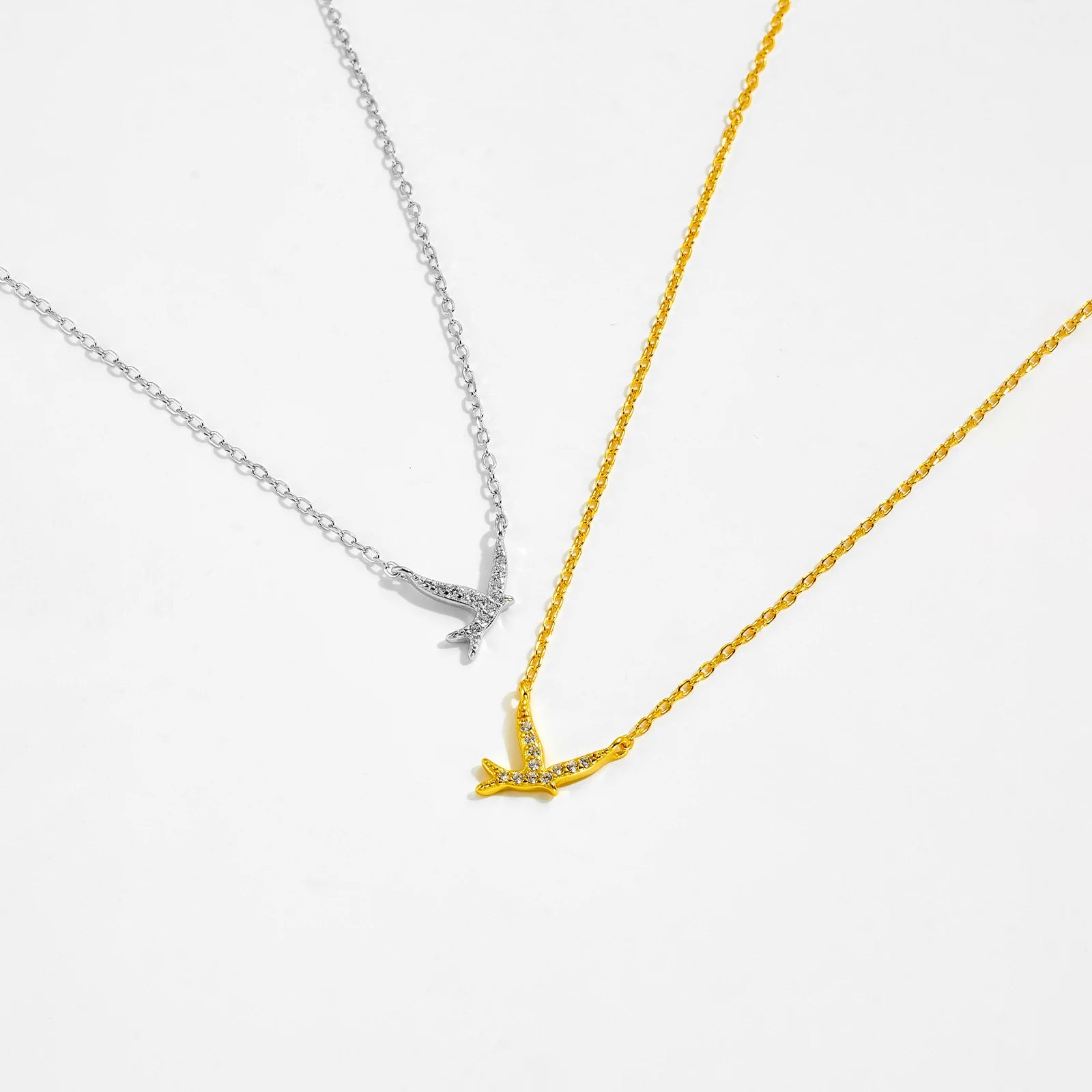 Bird pendant necklace symbolizes freedom, hope, and new beginnings. Crafted from 925 Sterling Silver and adorned with a sparkling AAA Cubic Zirconia, it captures the beauty of nature with a delicate design. The adjustable 40+5cm snake chain ensures a perfect fit for any neckline.