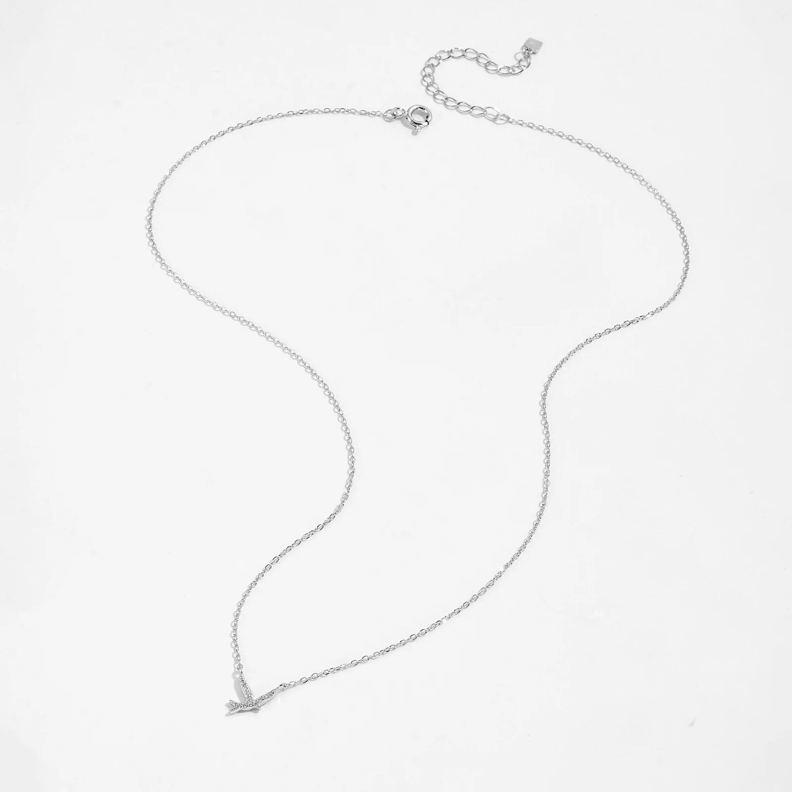 Bird pendant necklace symbolizes freedom, hope, and new beginnings. Crafted from 925 Sterling Silver and adorned with a sparkling AAA Cubic Zirconia, it captures the beauty of nature with a delicate design. The adjustable 40+5cm snake chain ensures a perfect fit for any neckline.